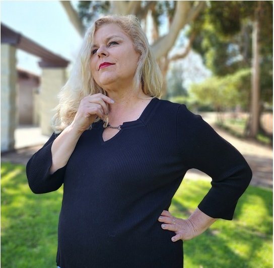 Lisa McCarthy looking toward the future outdoors in a black shirt